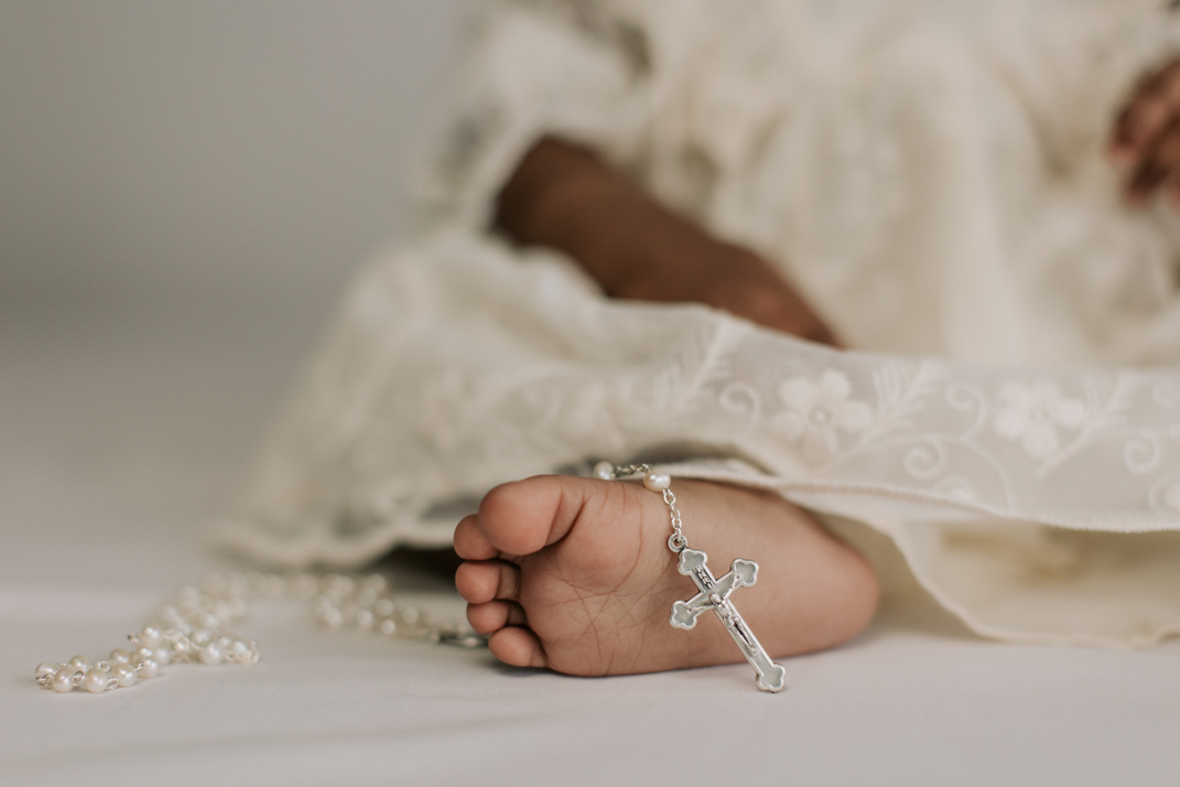 Rosary on a Baby's Foot