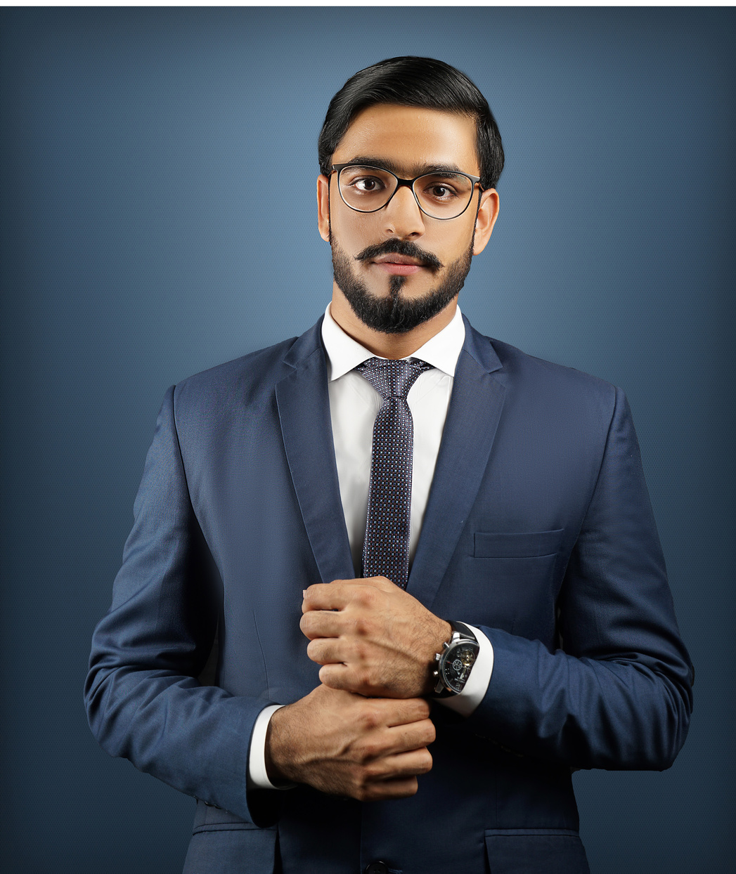 Photo of a Man with Eyeglasses Wearing a Blue Suit