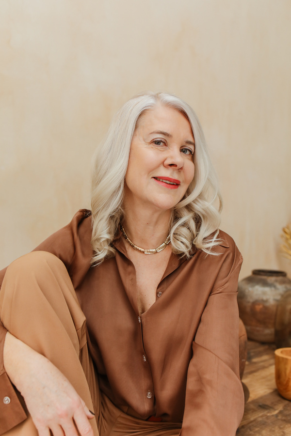 Stylish Mature Woman in Brown Clothes